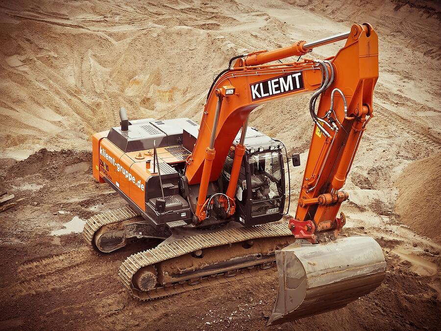 A tracked excavator parked on a construction site